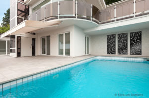 Elysium Decorative Screens House With Monstera Design Print Displayed in Three Screens Pool Side